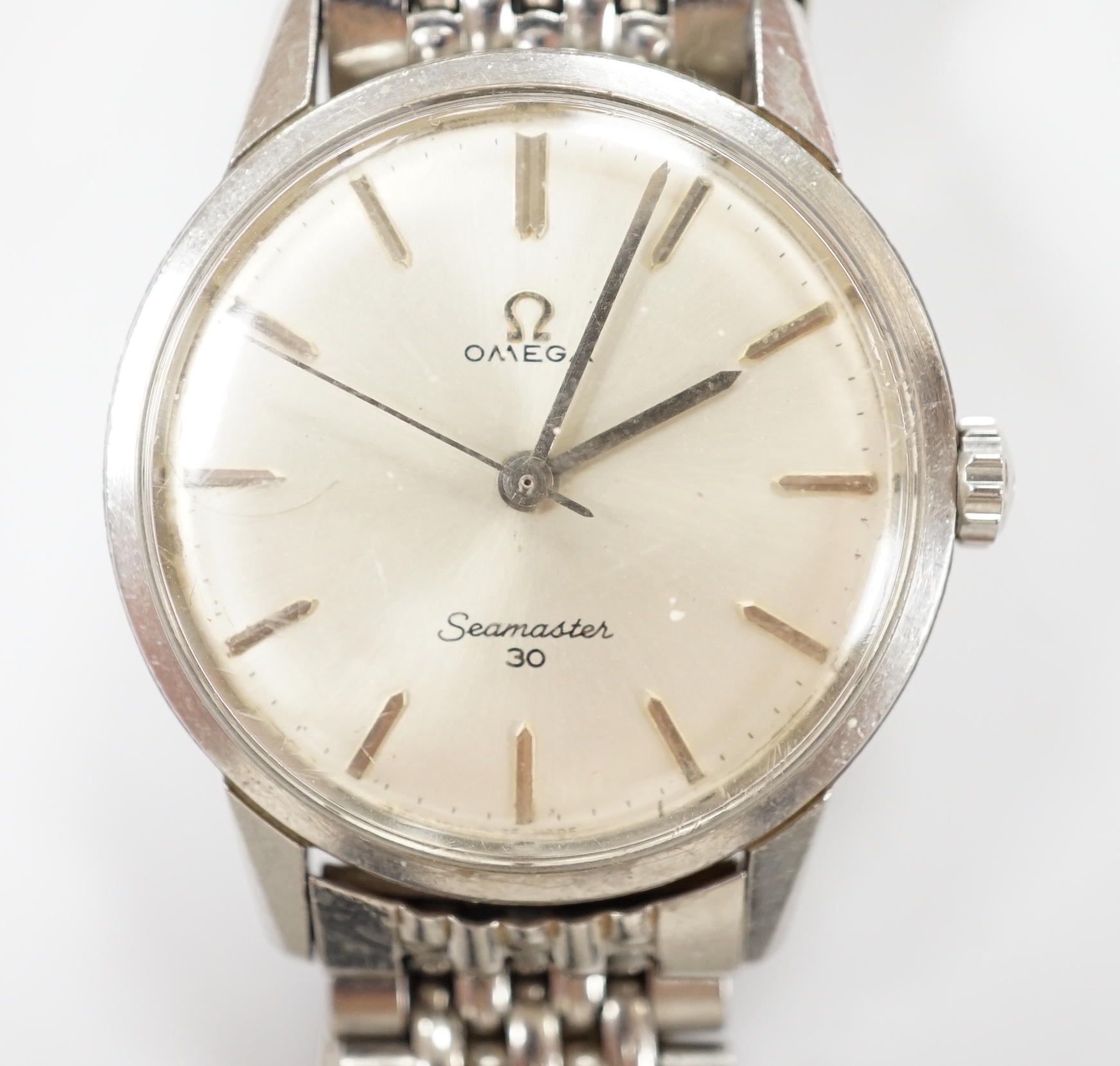 A gentleman's stainless steel Omega Seamaster 30 manual wind wrist watch, on a stainless steel Omega bracelet, case diameter 35mm, no box or papers.